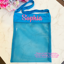 Load image into Gallery viewer, Blue mesh tote bag with 'Sophia' embroidered on it, placed on a textured surface with flowers in the background.