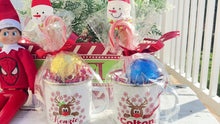 Load and play video in Gallery viewer, Personalized Holiday Hot Cocoa Mug for Kids with Hot Cocoa Bomb, Snowman Spatula &amp; Candy Cane
